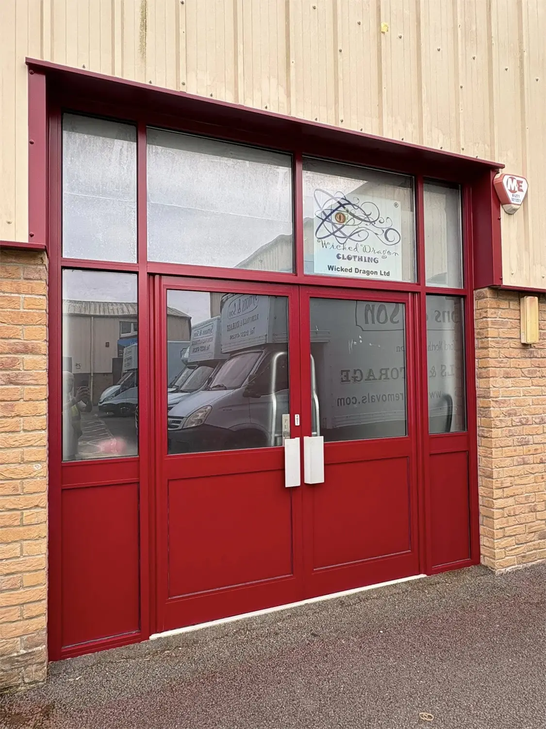Finished deep red commercial shopfront and entrance sprayed by Colourworkz